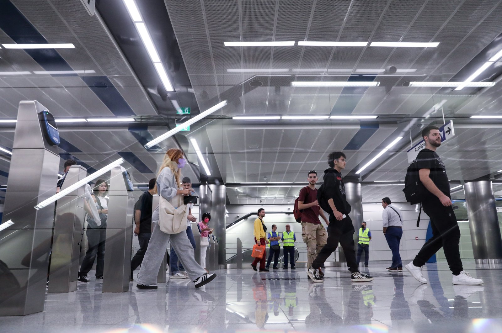 People enter the new metro station in Piraeus, one of three stations that link the port with Athens Airport, Greece, Oct. 10, 2022. (EPA Photo)