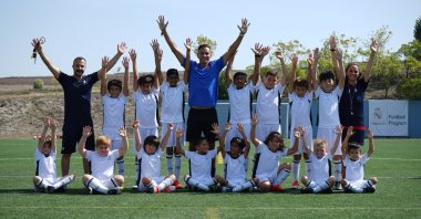 Trainers and students pose for a photo at the Real Madrid football academy in Istanbul, Türkiye, Oct. 1, 2022. (Courtesy Real Madrid Foundation Istanbul)