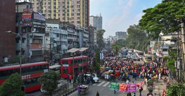Garment factory workers block a road as they protest to demand their unpaid wages and benefits in Dhaka, Bangladesh, Nov. 1, 2022. (AFP Photo)