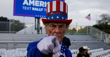 A costumed attendee arrives for a &quot;Save America&quot; rally ahead of the U.S. midterm elections, Miami, Florida, Nov. 6, 2022. (AFP Photo)