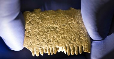 An ivory comb with a rare inscription at the conservation laboratory of the Hebrew University in Jerusalem, Israel, Nov. 8, 2022. (AFP Photo)