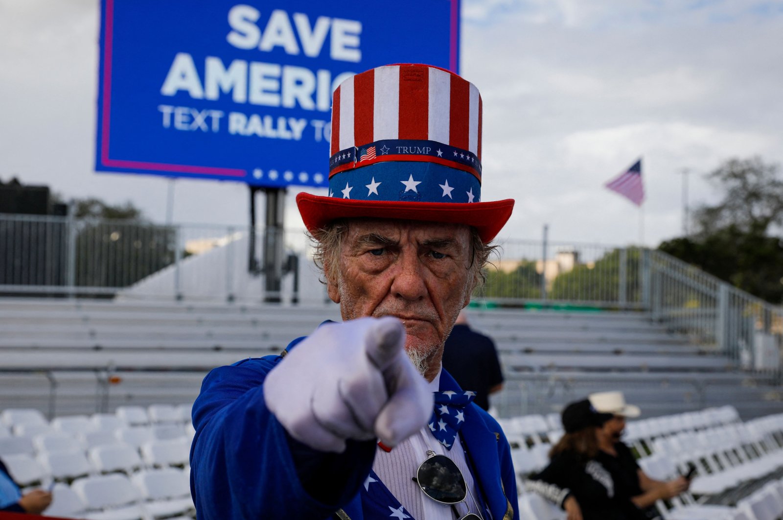 A costumed attendee arrives for a &quot;Save America&quot; rally ahead of the U.S. midterm elections, Miami, Florida, Nov. 6, 2022. (AFP Photo)