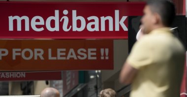 People walk past a Medibank branch in Sydney, Australia, Oct. 26, 2022. (AP Photo)