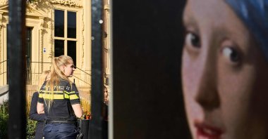 A police woman stands guard outside the Mauritshuis museum after an attempt to smear the Johannes Vermeer&#039;s painting &quot;Girl with a Pearl Earring&quot; in The Hague, Oct. 27, 2022.
