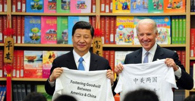 In this file photo taken on February 17, 2012, U.S. Vice President Joe Biden and his Chinese counterpart Xi Jinping display shirts with a message given to them by students at the International Studies Learning School in Southgate, outside Los Angeles. (AFP Photo)
