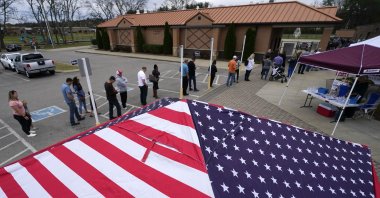 People line up to vote near tents set up by candidates' supporters, Nolensville, Tennessee, U.S., Nov. 8, 2022. (AP Photo)