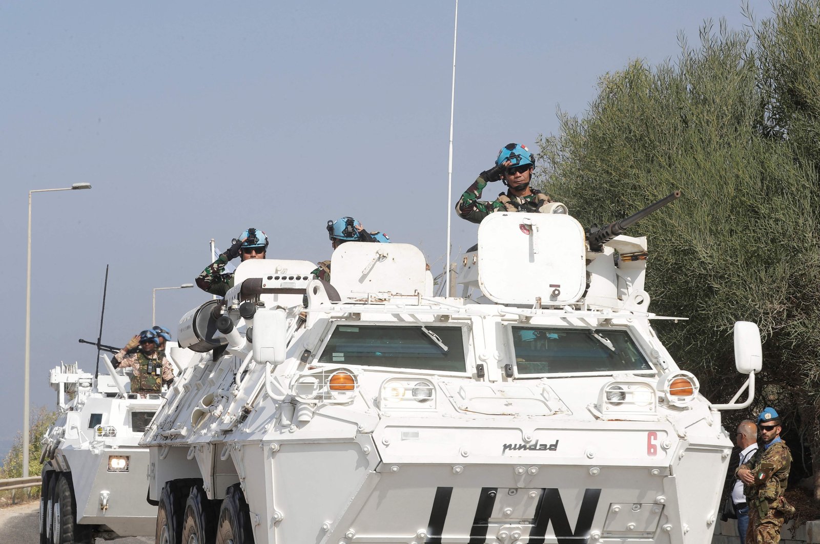 United Nations peacekeeping force in Lebanon (UNIFIL) vehicles drive along the main road leading to Lebanon&#039;s southern town of Naqura close to the border with Israel on Oct. 27, 2022. (AFP Photo)