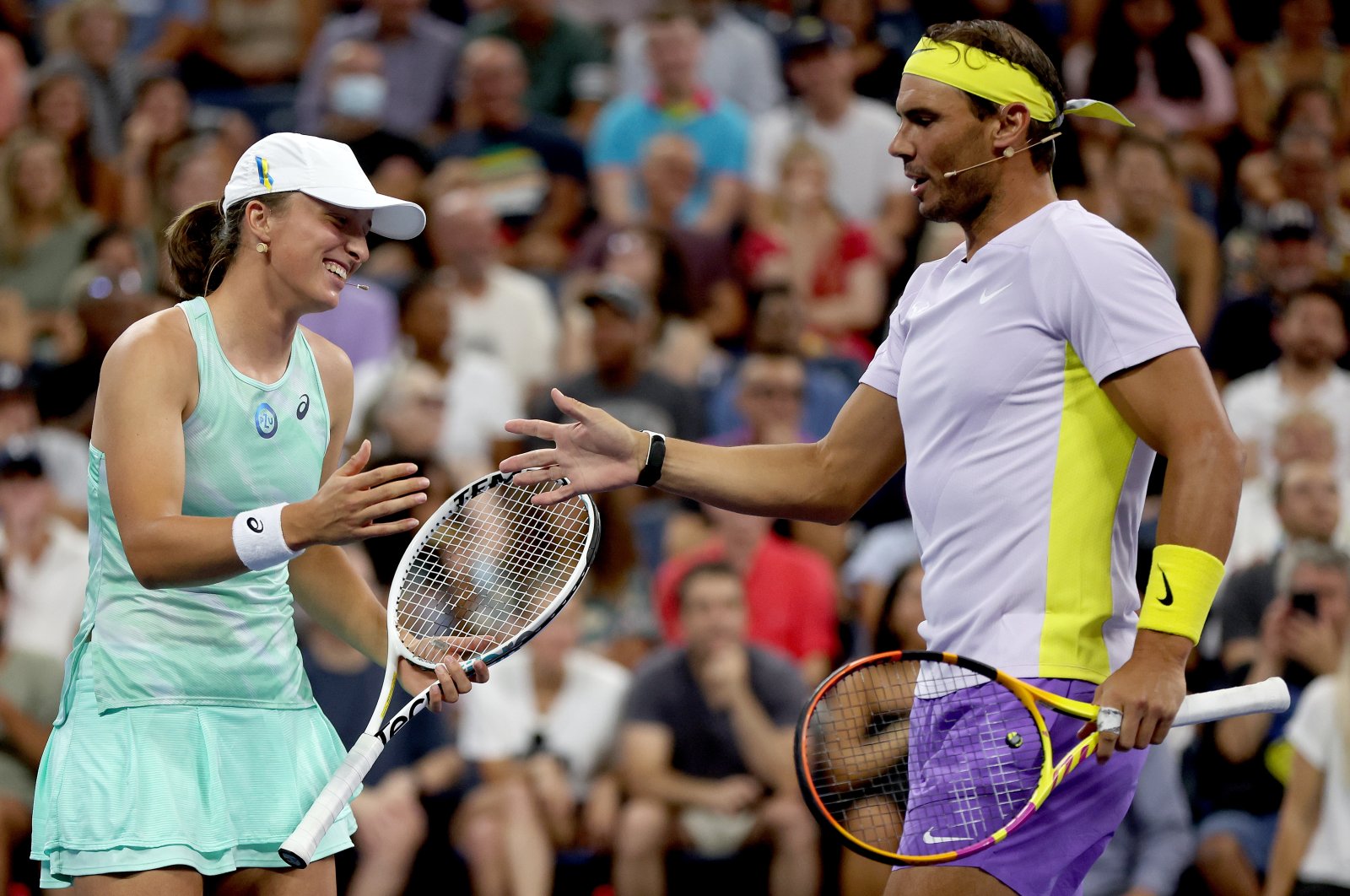 Poland&#039;s Iga Swiatek and Spain&#039;s Rafael Nadal celebrate a point against John McEnroe and Coco Gauff during the Tennis Plays For Peace exhibition matches to benefit Ukraine, at USTA Billie Jean King National Tennis Center, New York City, U.S., Aug. 24, 2022. (Getty Images Photo)