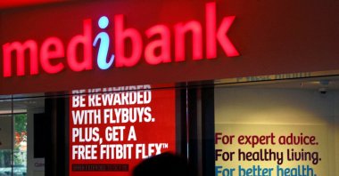 A woman walks past a branch of the Australian health insurer Medibank Private, Sydney, Australia, Oct. 20, 2014. (Reuters Photo)