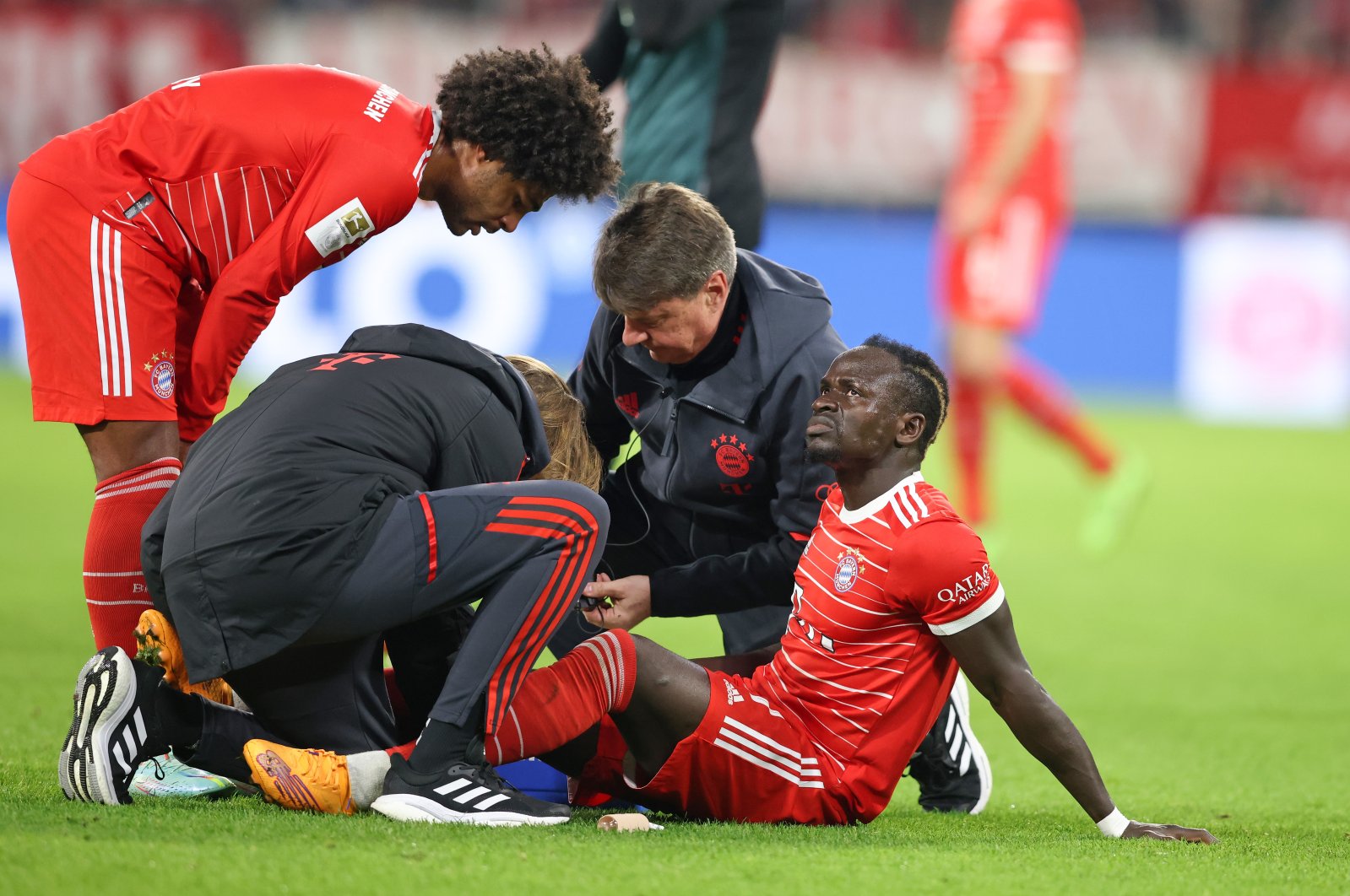 Sadio Mane of Bayern Munich receives medical aid after being injured during the Bundesliga match between FC Bayern München and SV Werder Bremen at Allianz Arena, Munich, Germany, Nov. 8, 2022. (Getty Images Photo)