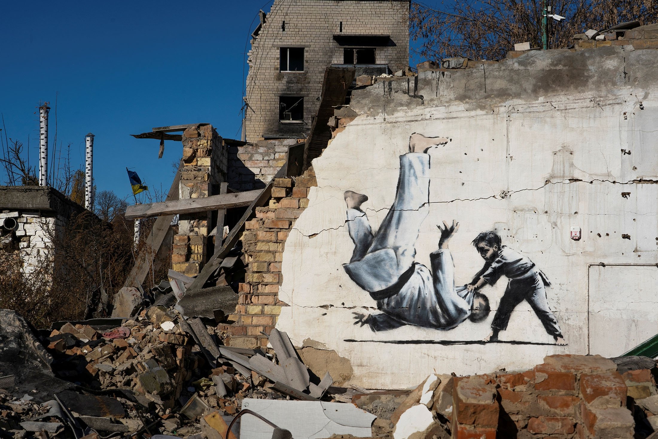 Banksy unveils new graffiti in bombed-out Ukrainian town