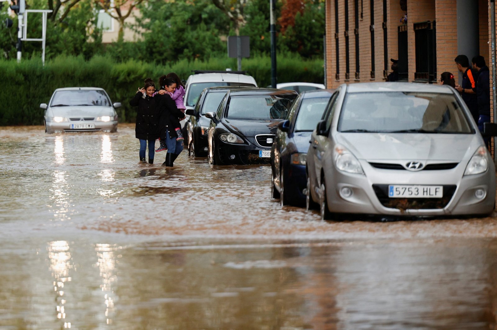People walk on a flooded street, as heavy rains hit the Valencia region, in Aldaia, Spain, Nov. 12, 2022. (Reuters Photo)