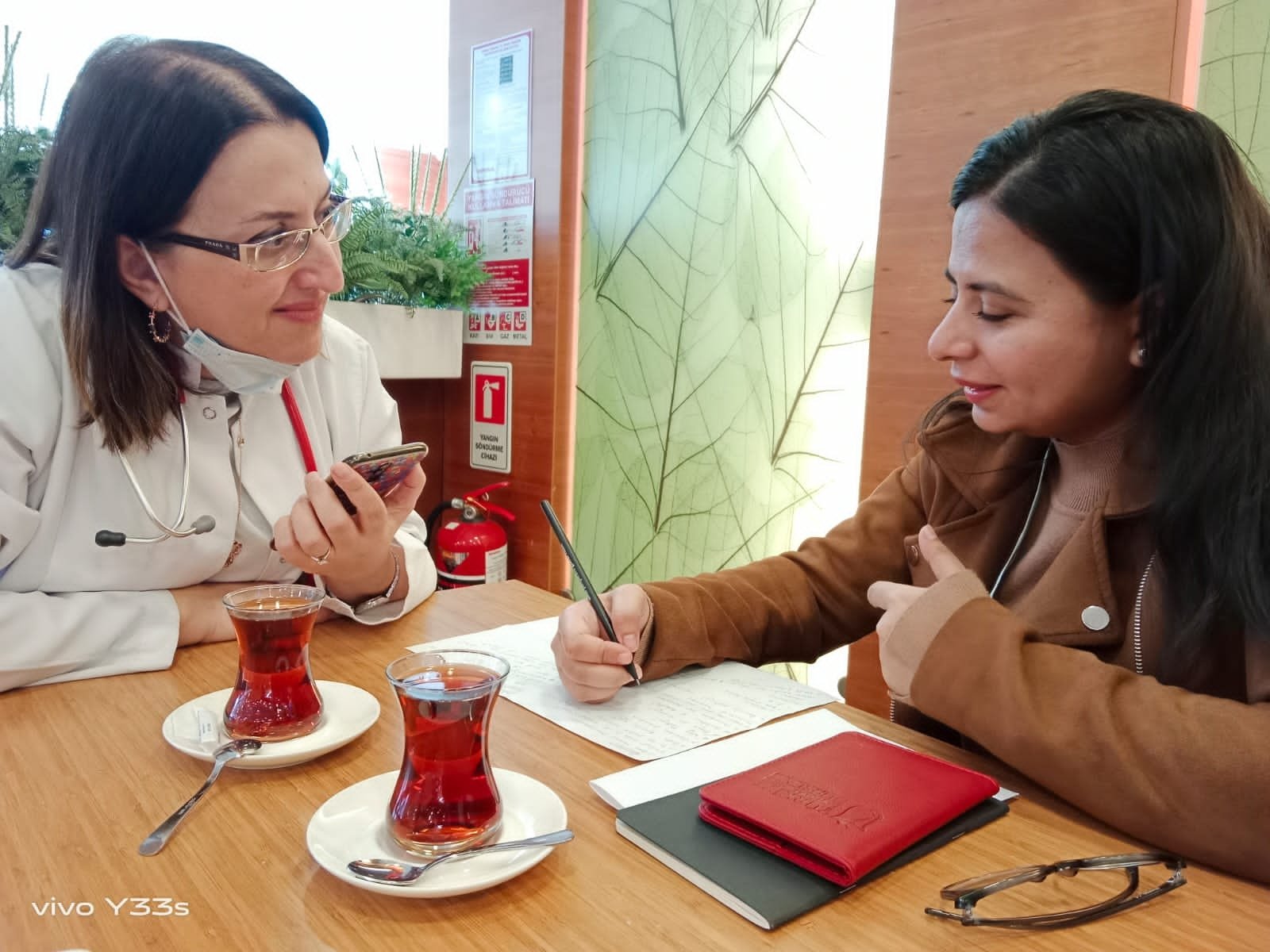 Dr. Betül Tavil (L) is interviewed by Daily Sabah&#039;s Sisa Bodani, Memorial Hospital, Istanbul, Türkiye, Nov. 12, 2022. (Photo by Begüm Çelikkol)