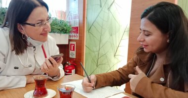 Dr. Betül Tavil (L) is interviewed by Daily Sabah&#039;s Sisa Bodani, Memorial Hospital, Istanbul, Türkiye, Nov. 12, 2022. (Photo by Begüm Çelikkol)