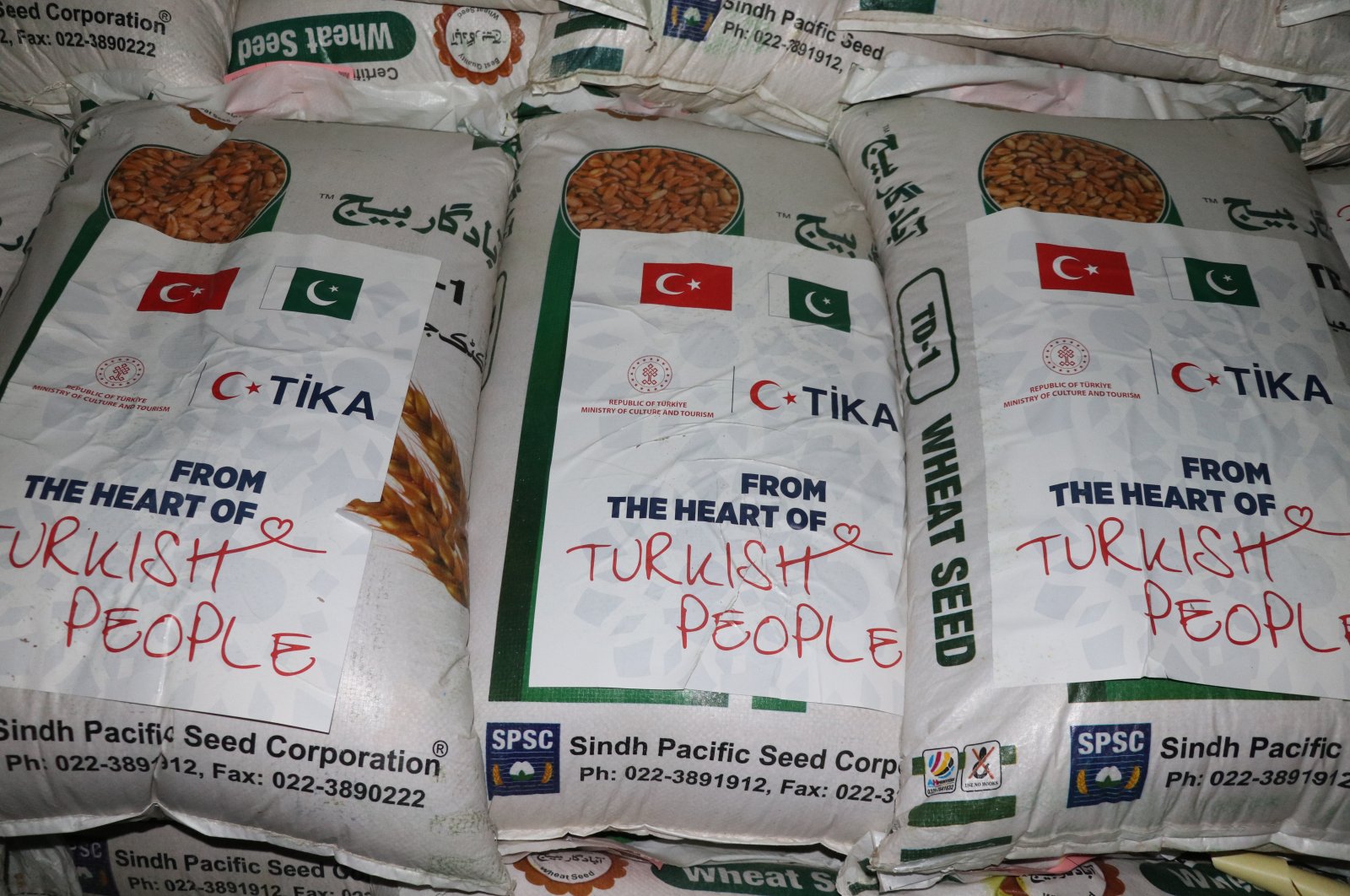 Packets included in the 60 tons of wheat aid sent and distributed by the Turkish Cooperation and Coordination Agency (TIKA) for Pakistan&#039;s flood-hit Sind province. (AA Photo)