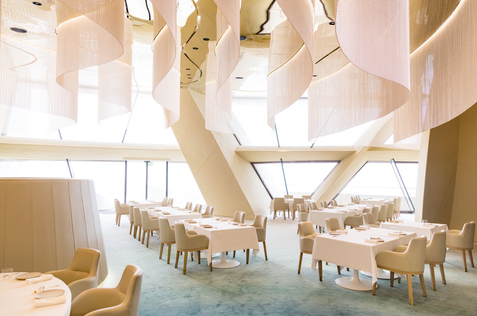 The restaurant Jiwan, Qatari for &quot;The Perfect Pearl,&quot; is decorated in warm cream and gold tones. The meters-high windows offer a dreamlike view of the Doha skyline and the sea, Qatar, March 10, 2020. (dpa Photo)