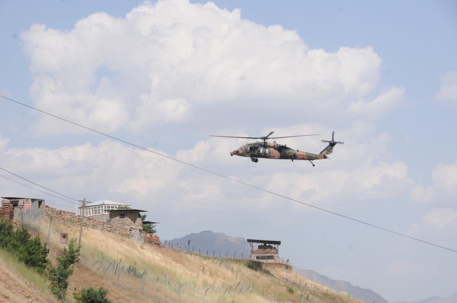 A Turkish Armed Forces (TSK) helicopter runs announcements for terrorists to surrender over mountains in Türkiye&#039;s Hakkari province bordering northern Iraq, Türkiye, Oct. 30, 2022. (DHA Photo)