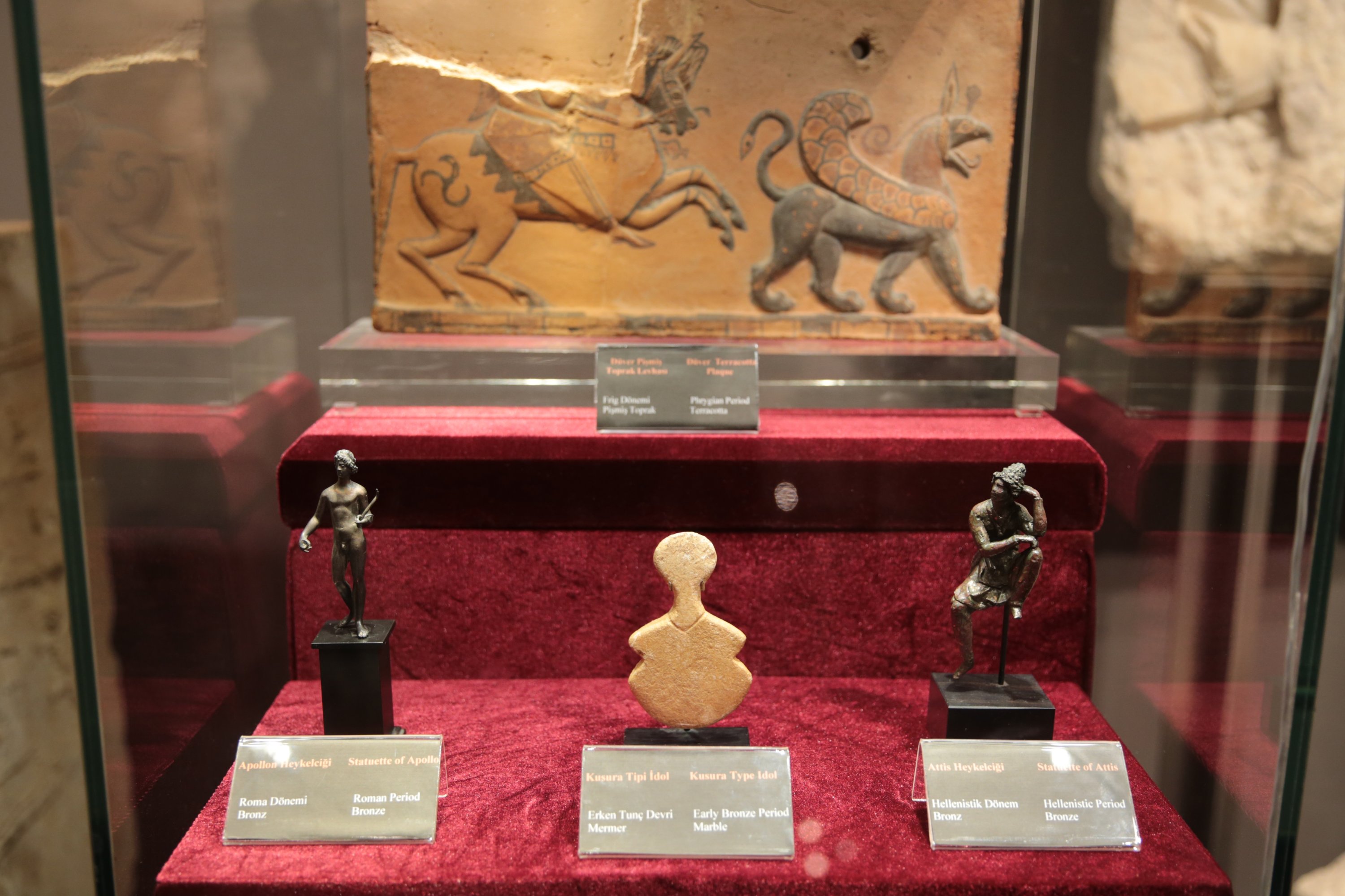 Attis and Apollo figurines, a Kusura-type idol and a terracotta plate smuggled to the U.S. years ago and returned to their homeland are on display in Antalya, Türkiye, Nov. 13, 2022. (AA Photo)
