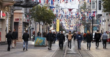 People walk on Istiklal Street, in Istanbul, Türkiye, Nov. 14, 2022. (AA Photo)