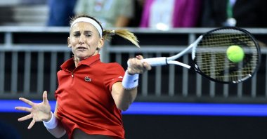 Switzerland's Jil Teichmann returns to Australia's Storm Sanders during the final tennis match between Switzerland and Australia during the Billie Jean King Cup, Glasgow, U.K., Nov. 13, 2022. (AFP Photo)