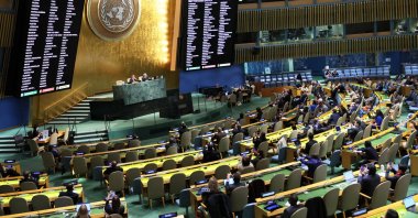Members of the General Assembly vote on a draft resolution during a special session in the General Assembly Hall at United Nations Headquarters on Nov. 14, 2022 in New York City. (AFP Photo)