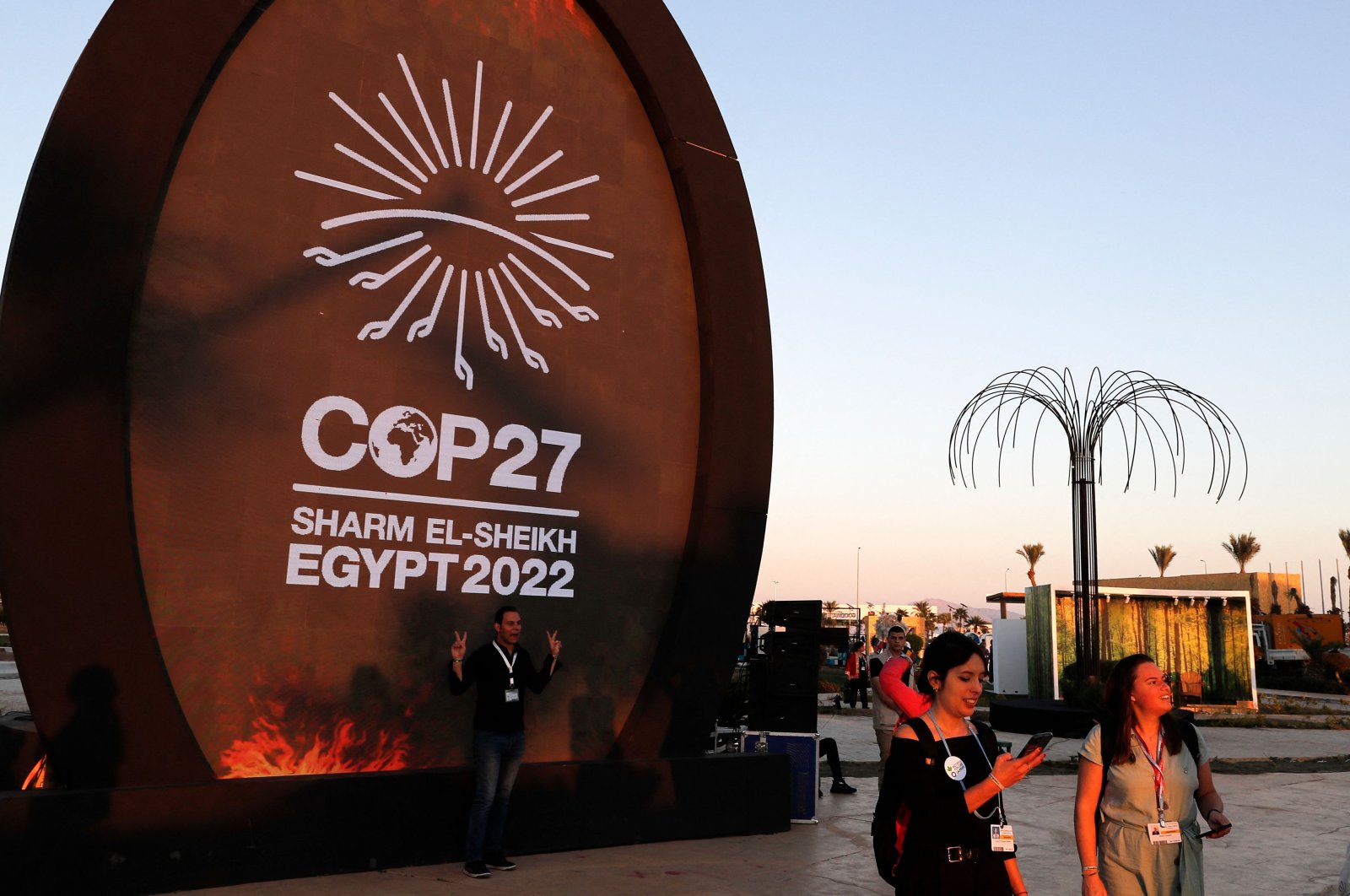 People walk in the green zone of the International Convention Centre, during the COP27 climate conference, Sharm el-Sheikh, Egypt, Nov. 9, 2022. (AFP Photo)