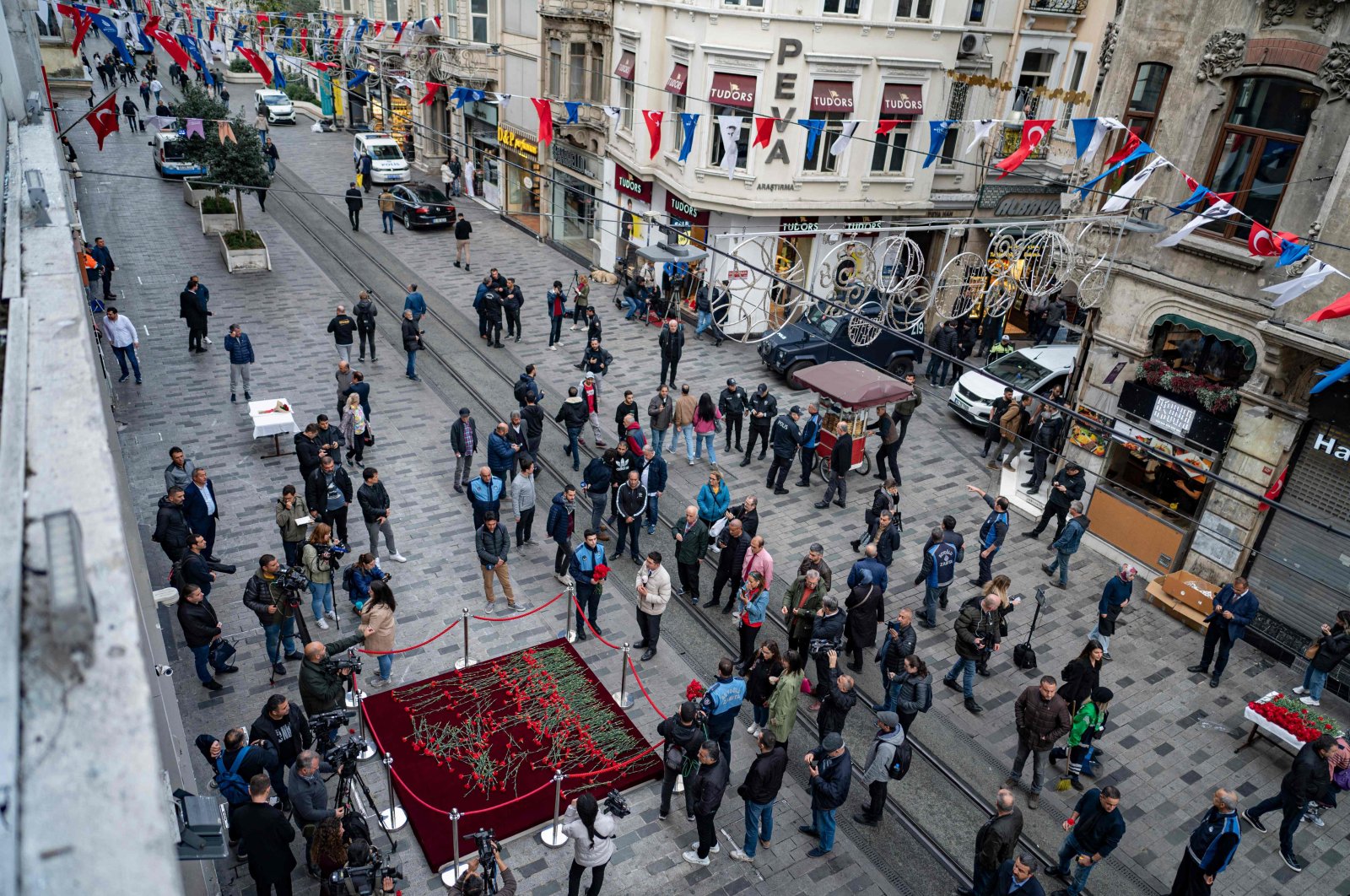 People mourn the victims of the Nov. 13 attack on Istiklal Street, in Istanbul, Türkiye, Nov. 14, 2022. (AFP Photo)