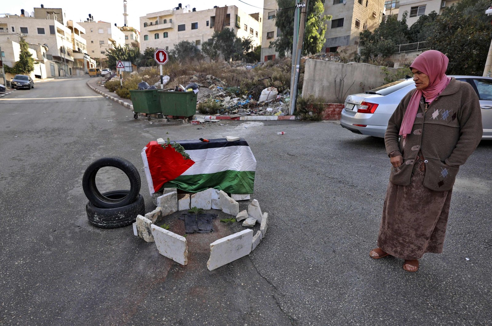 A Palestinian stands next to the place where 19-year-old Sana al-Tal was shot by Israeli forces, Ramallah, occupied West Bank, Nov. 14, 2022. (AFP Photo)