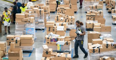 Workers sort packages at the Amazon AGS5 facility in Appling, Georgia, U.S., Oct. 27, 2022. (AFP Photo) 