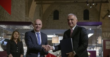 Culture and Tourism Minister Mehmet Nuri Ersoy (R) and Swiss Interior Minister Alain Berset shake hands after signing an agreement in Ankara,Türkiye, Nov. 15, 2022. (AA Photo)