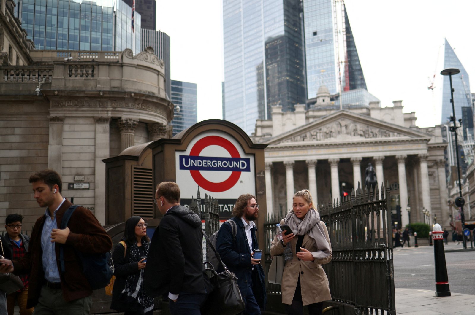 People exit Bank underground station in the City of London financial district during rush hour in London, Britain, Oct. 3, 2022. (Reuters Photo)