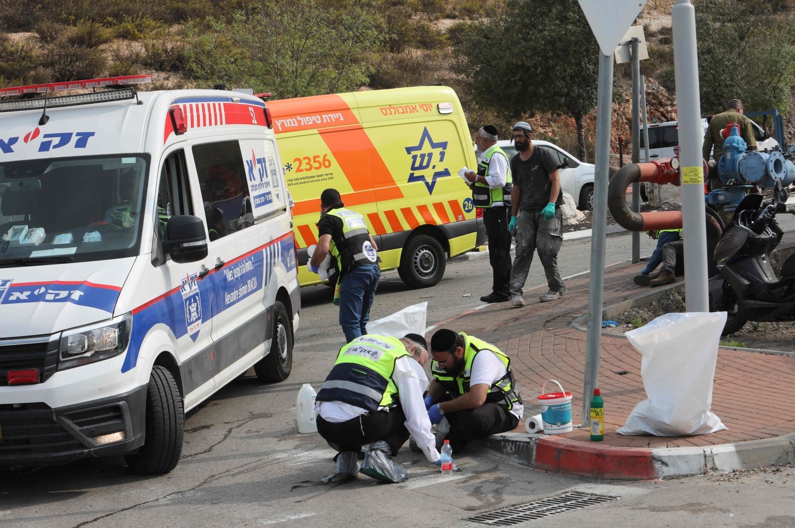 An ultra-Orthodox Jewish emergency response team works at the scene of an attack in the occupied West Bank, Palestine, Nov. 15, 2022. (AFP Photo)