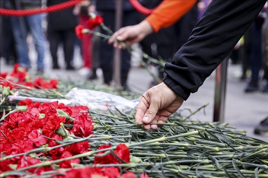 Flowers are left at the spot of the terrorist attack in Istiklal Street, as people grieve the victims, in Istanbul, Türkiye, Nov. 14, 2022. (AFP Photo)