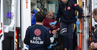Paramedics attend a man being hospitalized for bootleg alcohol poisoning in Bursa, northwestern Türkiye, Nov. 14, 2022. (DHA Photo)