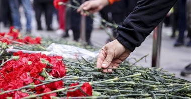 Flowers are left at the spot of the terrorist attack in Istiklal Street, as people grieve the victims, in Istanbul, Türkiye, Nov. 14, 2022. (AFP Photo)