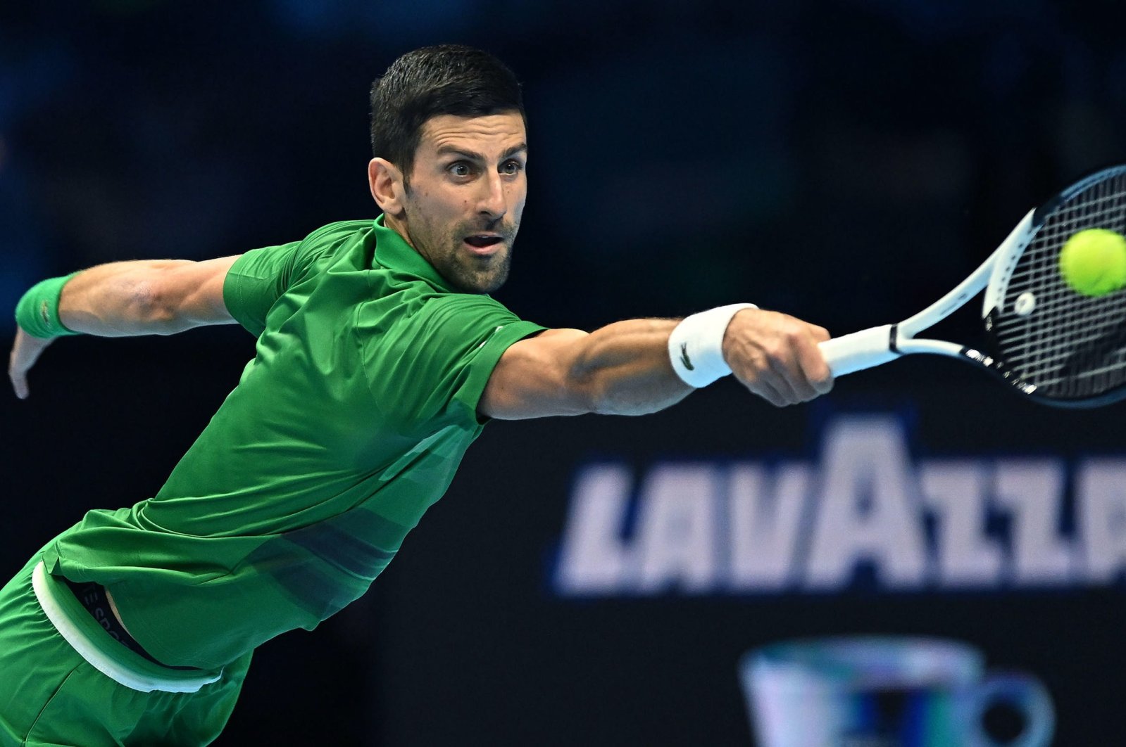Novak Djokovic of Serbia in action against Stefanos Tsitsipas of Greece during their group match of the Nitto ATP Finals 2022 tennis tournament at the Pala Alpitour arena, Turin, Italy, Nov. 14 2022. (EPA Photo)