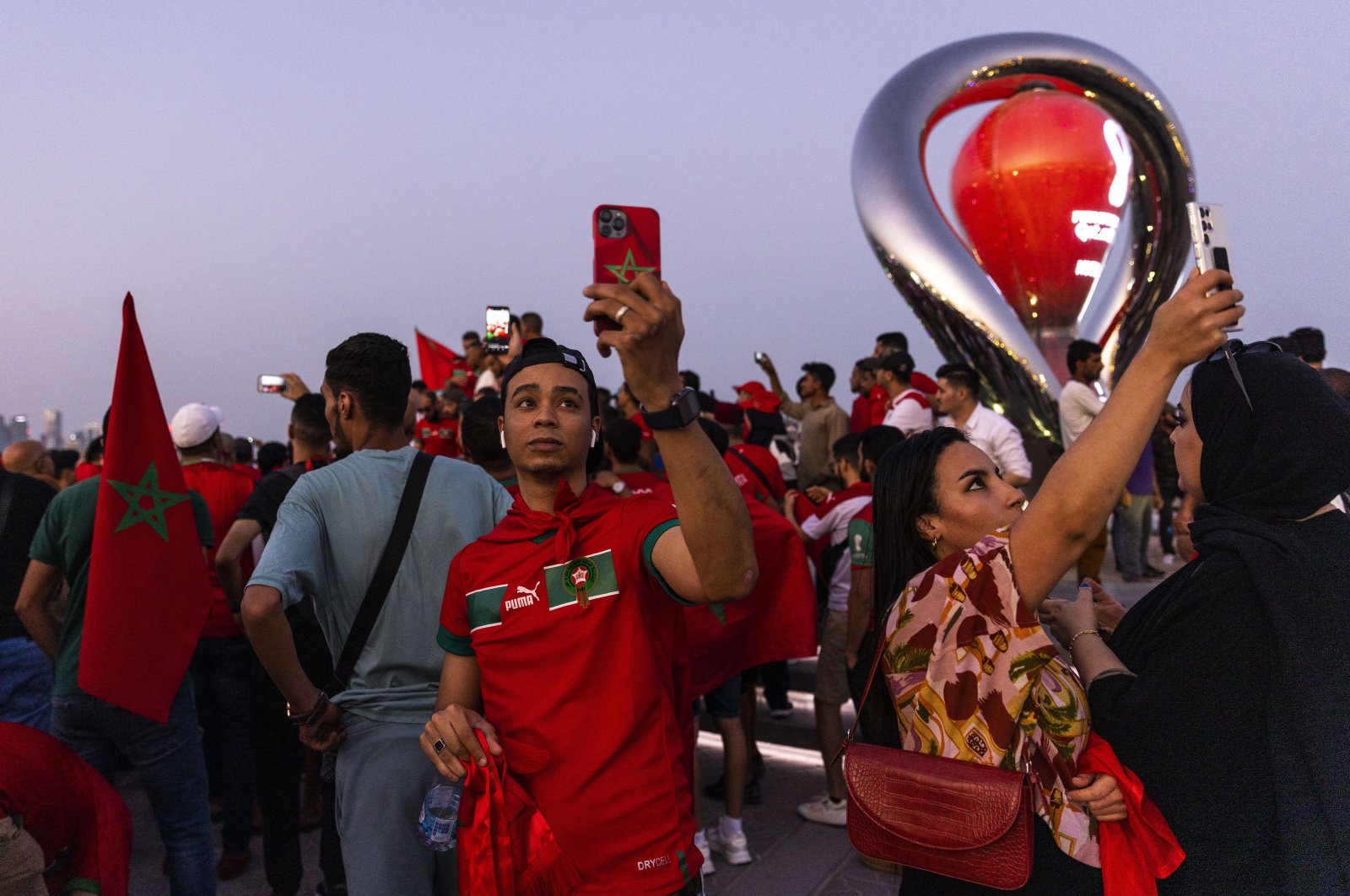 Fans of Morocco take photos next to the Hublot World Cup Official countdown watch at Doha Corniche ahead of the FIFA World Cup Qatar 2022. Doha, Qatar, Nov. 14, 2022. (Getty Images Photo)