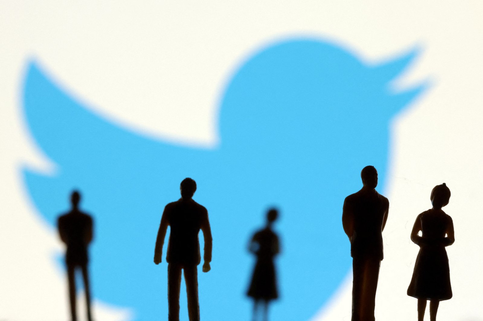 Small figurines and the Twitter logo are seen in this illustration taken on Nov., 4, 2022. (Reuters Photo)