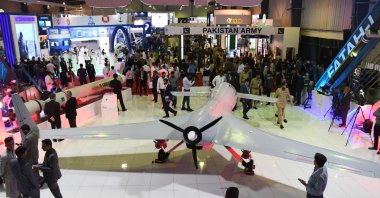 Visitors inspect products at the four-day International Defence Exhibition and Seminar (IDEAS) in Karachi, Pakistan, Nov. 16, 2022. ( AA Photo)