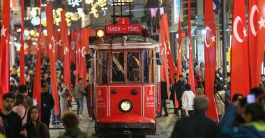 People walk on Istiklal Street, in Istanbul, Türkiye, Nov. 16, 2022. (AA Photo) 