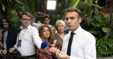 French President Emmanuel Macron speaks to the press as he visits the Jim Thompson House Museum, Bangkok, Thailand, Nov. 17, 2022. (AFP Photo)