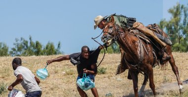 Photographer Paul Ratje got third prize in the "Single News" category with "Migrants at Texas border" shot for Agence France-Presse (AFP) in Texas, U.S., in the Istanbul Photo Awards 2022.