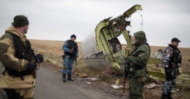 Pro-Russian gunmen guard parts of the Malaysia Airlines Flight MH17 at the crash site, Grabove, eastern Ukraine, Nov. 11, 2014. (AFP Photo)