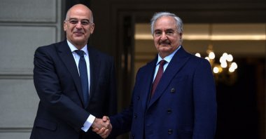  In this file photo taken on Jan. 17, 2020, Greek Foreign Minister Nikos Dendias (L) welcomes putschist Gen. Khalifa Haftar before talks in Athens, days ahead of a peace conference in Berlin. (AFP File Photo)