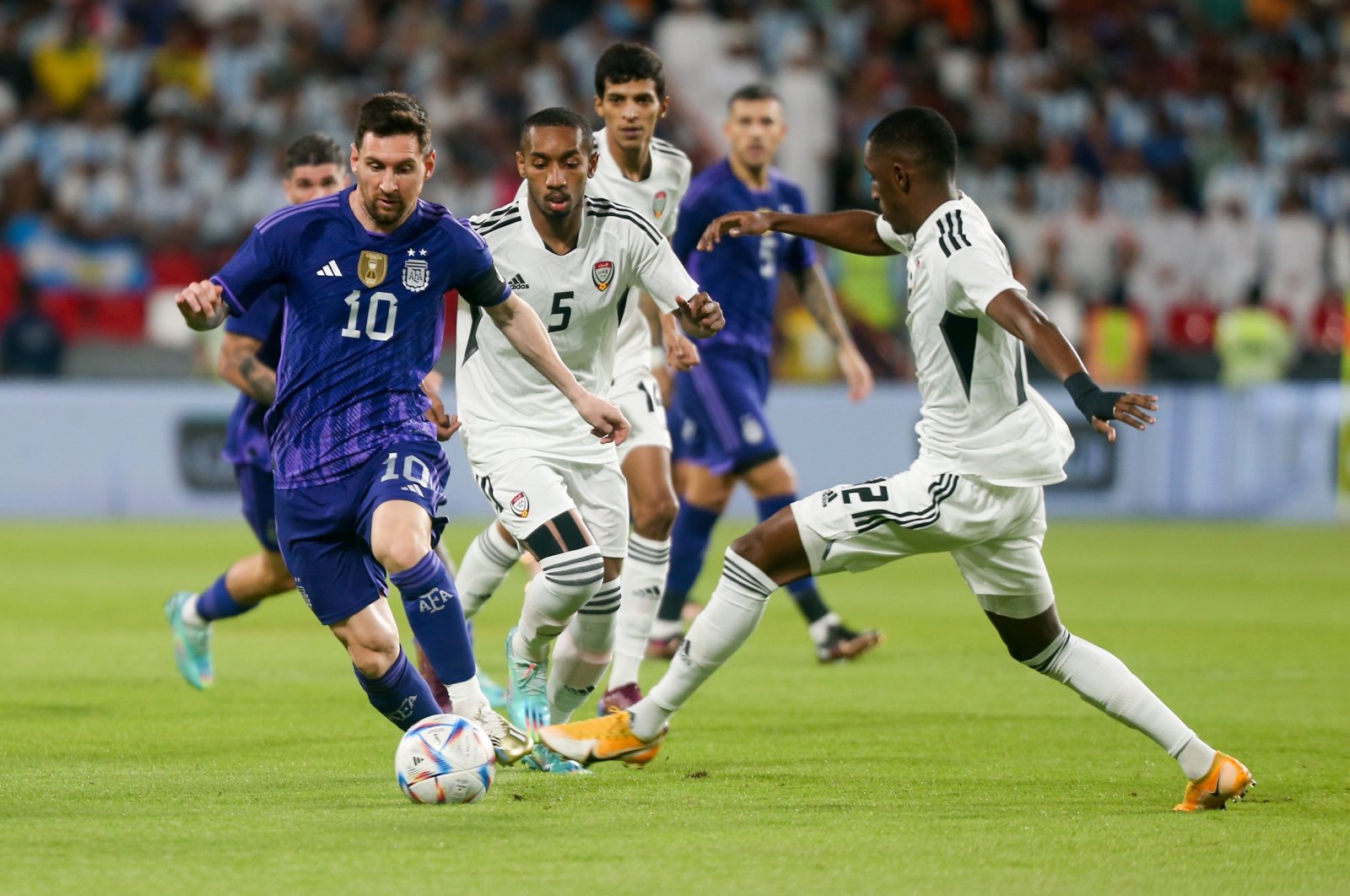 UAE national football player Khalifa al-Hammadi (R) vies for the ball with Argentine football player Lionel Messi (L) at the Mohammed Bin Zayed Stadium, Abu Dhabi, UAE, Nov. 16, 2022. (AA Photo)