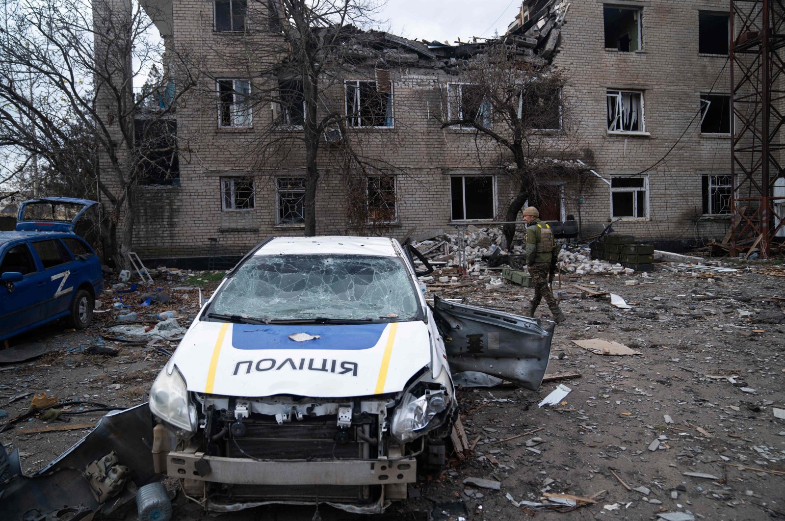 A Ukrainian soldier inspects a destroyed police station that was used by Russian troops as a base in the village of Snihurivka, Mykolaiv, Ukraine, Nov. 16, 2022. (AFP Photo)