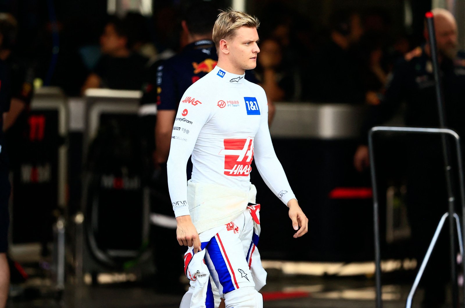 Haas F1 Team&#039;s German driver Mick Schumacher walks in the pit lane during the qualifying session for the Formula One Mexico Grand Prix, at the Hermanos Rodriguez racetrack, Mexico City, Oct. 29, 2022. (AFP Photo)