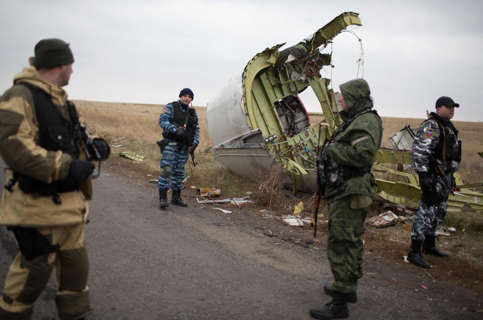 Pro-Russian gunmen guard parts of the Malaysia Airlines Flight MH17 at the crash site, Grabove, eastern Ukraine, Nov. 11, 2014. (AFP Photo)