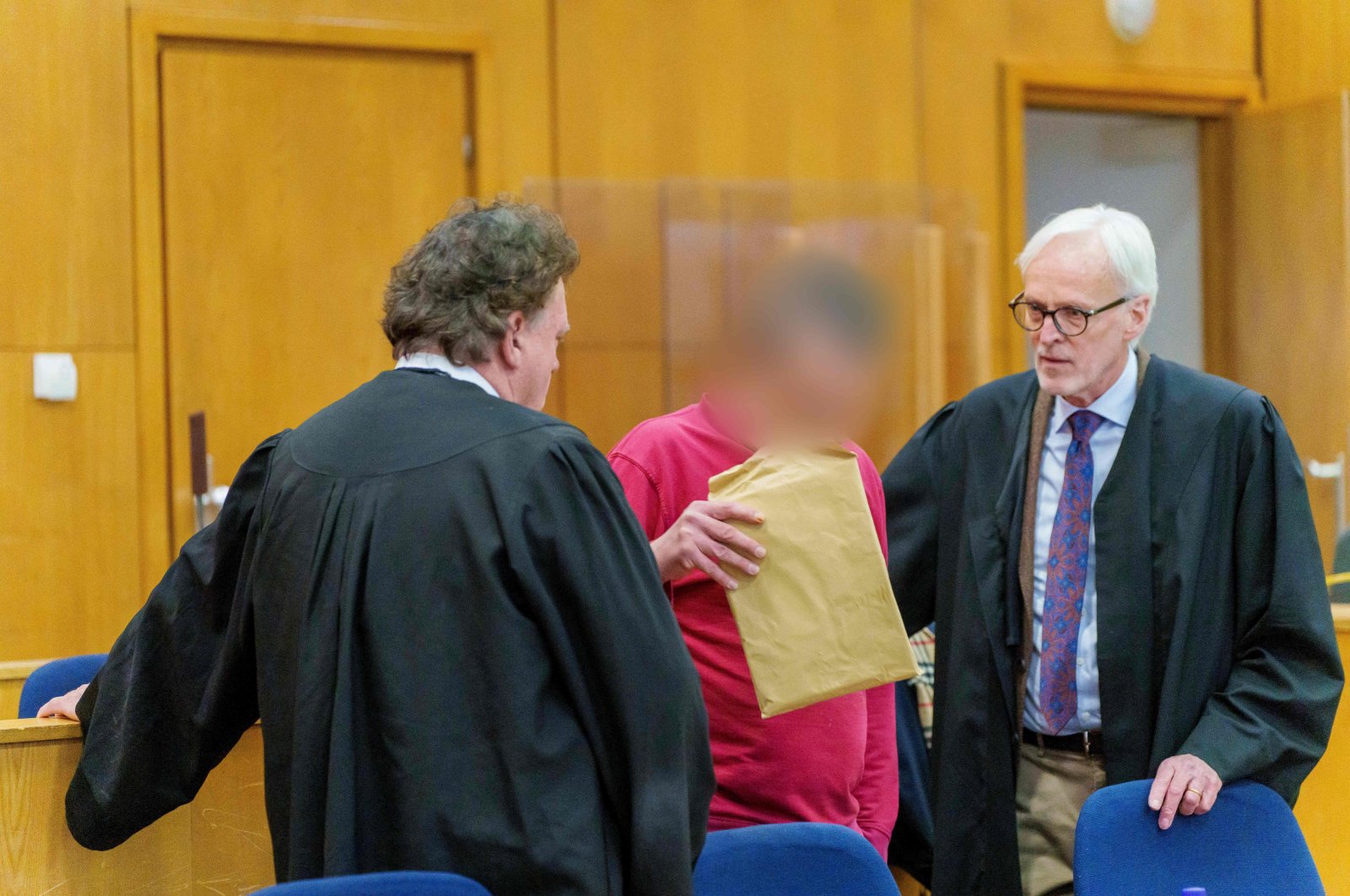The defendant and alleged author of "NSU 2.0" threatening letters talks to his lawyer ahead of the continuation of his trial in Frankfurt am Main, western Germany, Nov. 17, 2022. (AFP Photo)