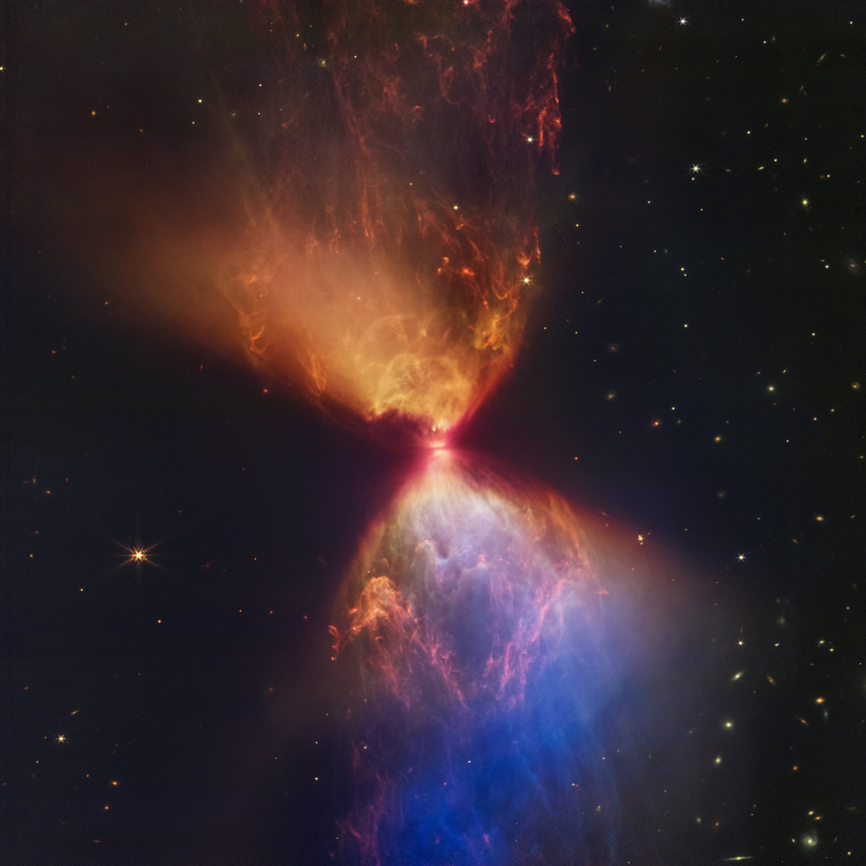 Protobintang di dalam awan gelap L1527 tertanam di dalam awan material yang memberi makan pertumbuhannya, ditangkap oleh James Webb Space Telescope, 16 November 2022. (AP Photo)